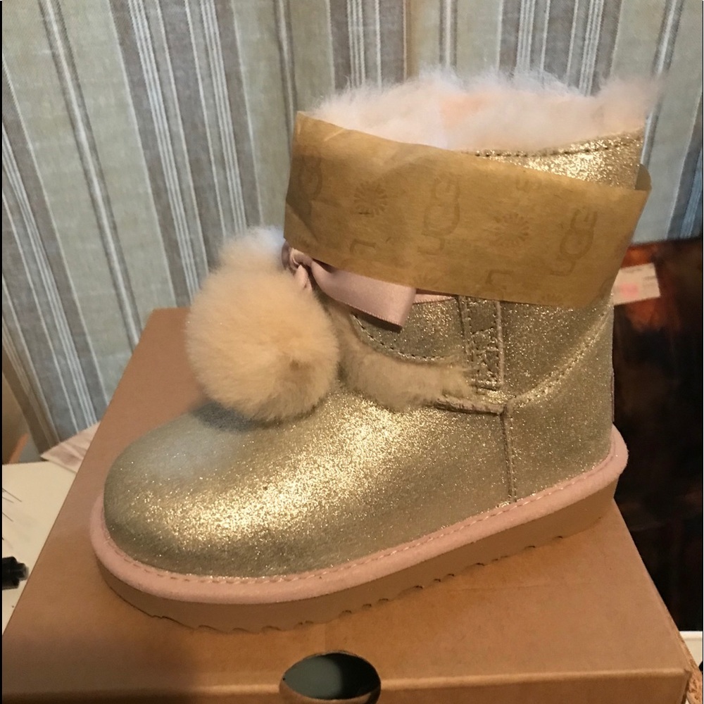 Girl’s gold metallic UGGS